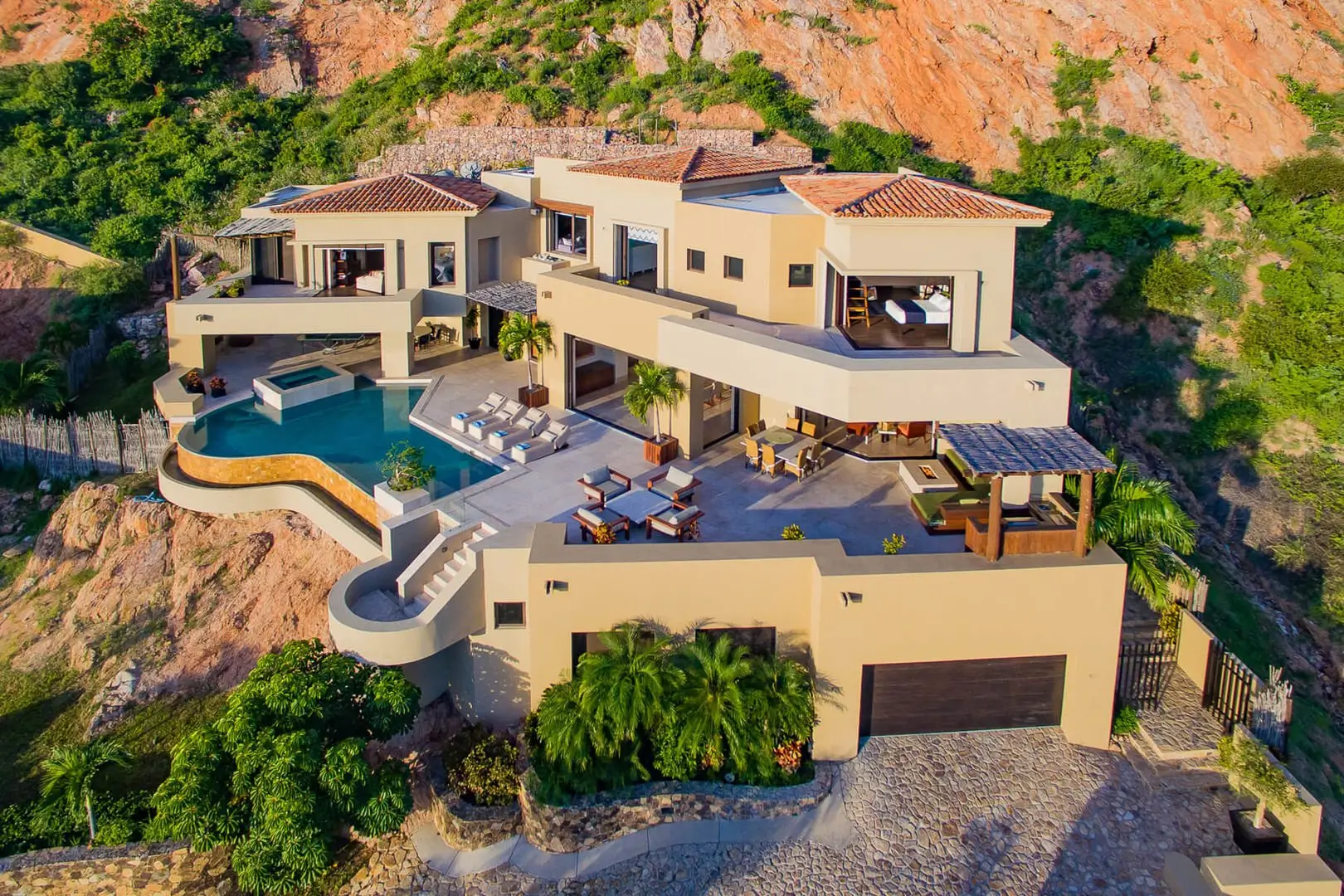 Beachfront Condos in Cabo San Lucas along Medano Beach with swimmable shoreline and marina views